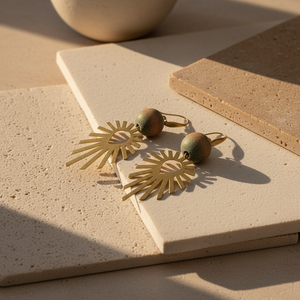 Pair of gold earrings on a white background