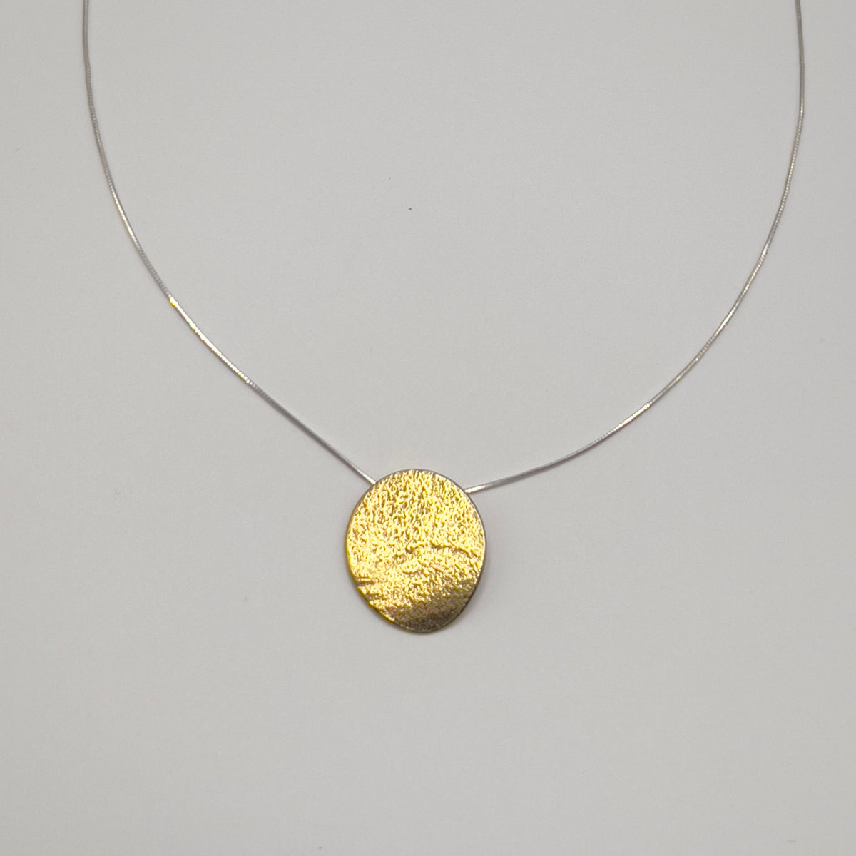 Woven Fate Pendant Necklace