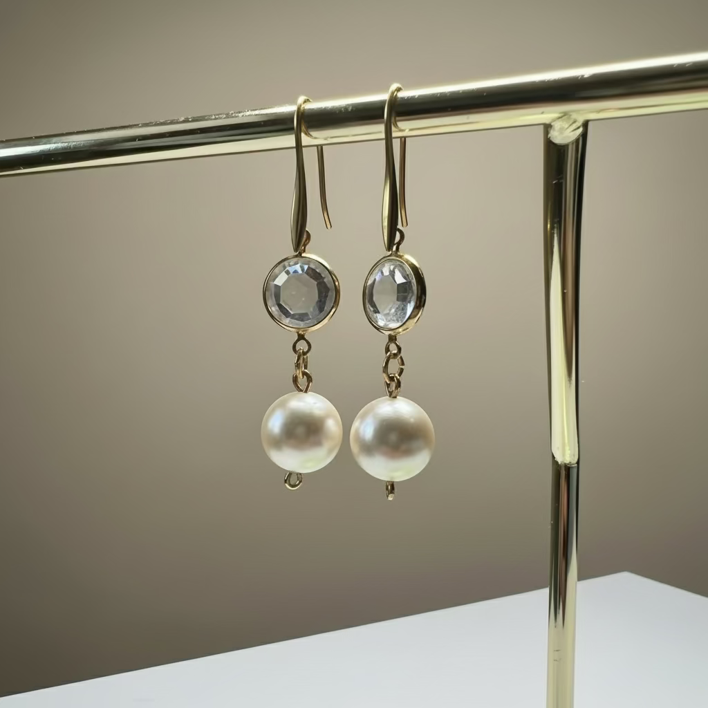 Pearl earrings on a stand with a blurred background